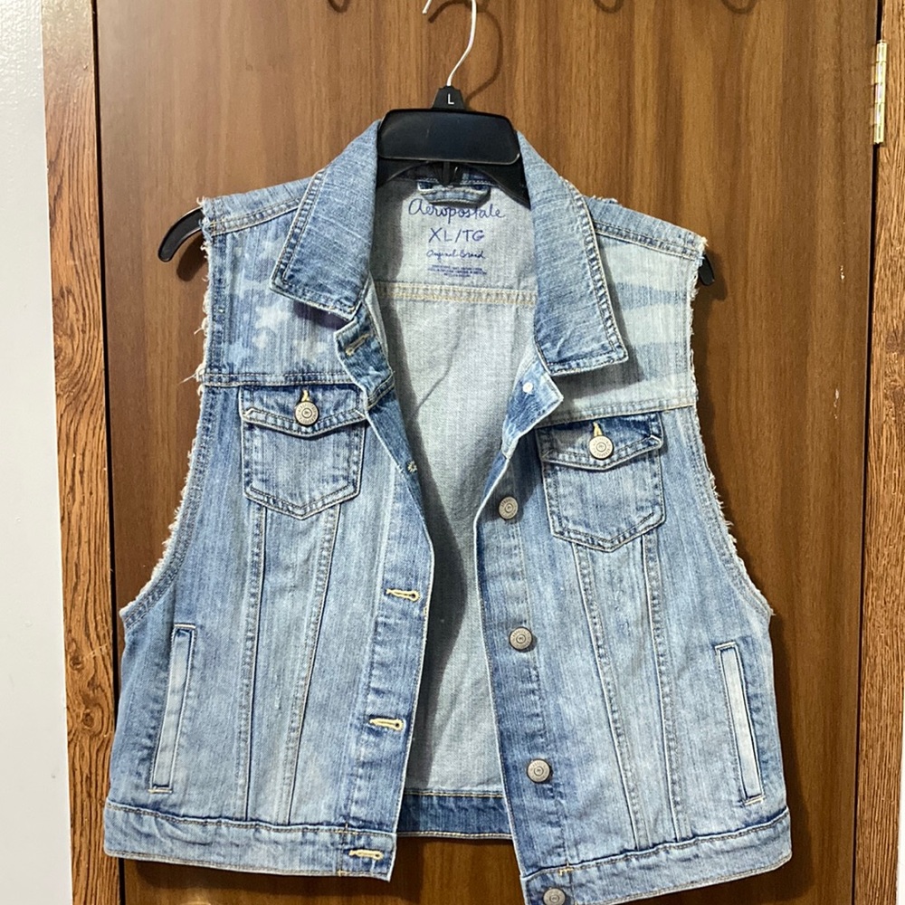 Ripped (intentionally) blue Jean button down vest